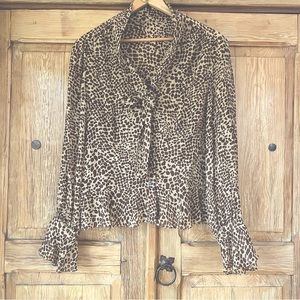 Animal print top ruffle cuffs and hem with self tie front and dark shell buttons
